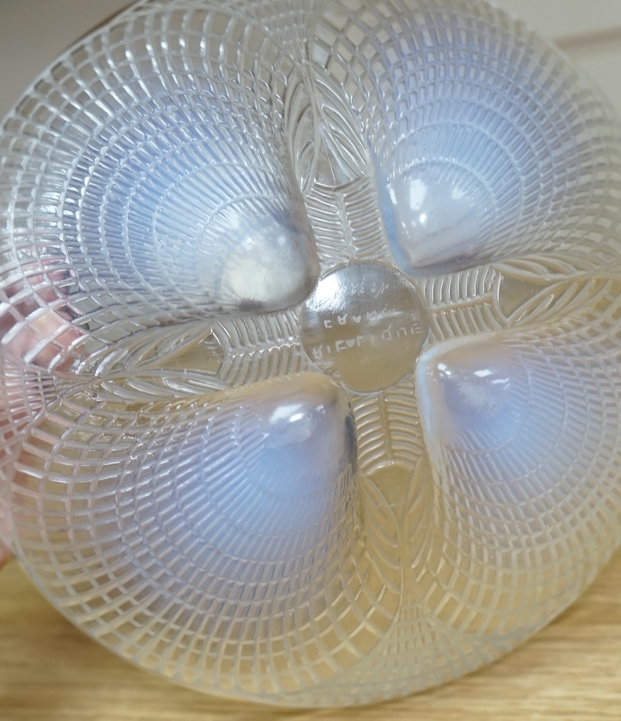 An R. Lalique coquille pattern glass bowl, no.3201, 21cm diameter. Condition - wear to base as expected, otherwise good